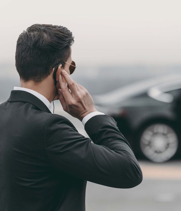 handsome-bodyguard-standing-and-listening-message-A78BNHN.jpg